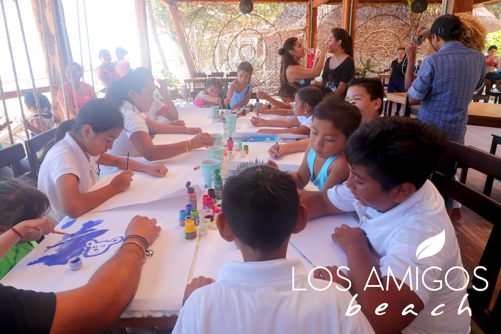 Kids celebrating at Los Amigos Beach